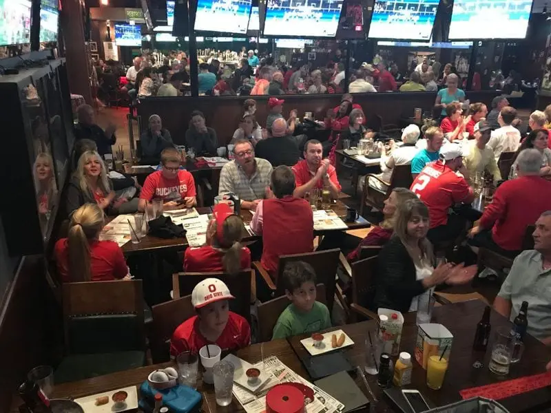 A full house of members at a sports bar game watch